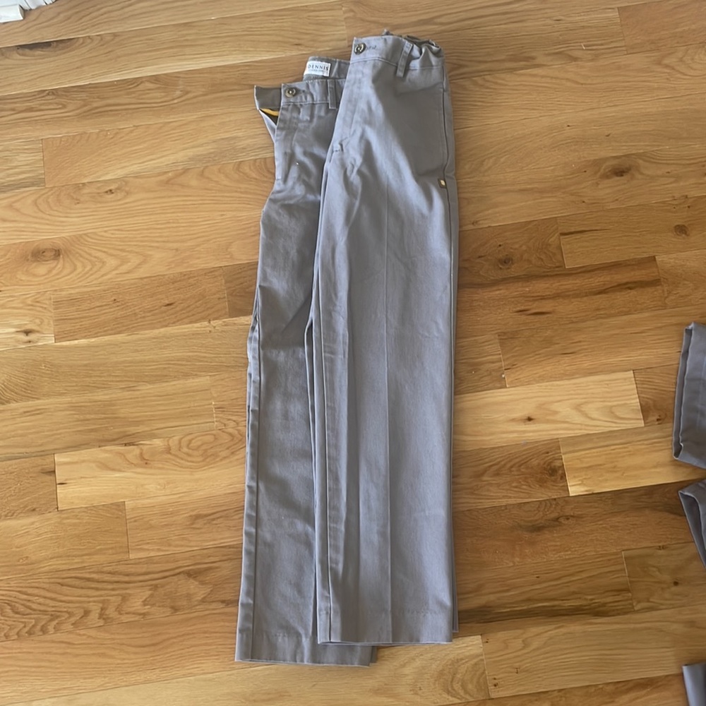 Two pairs of Dennis uniform pants in a size boys 12 slim. Used condition.